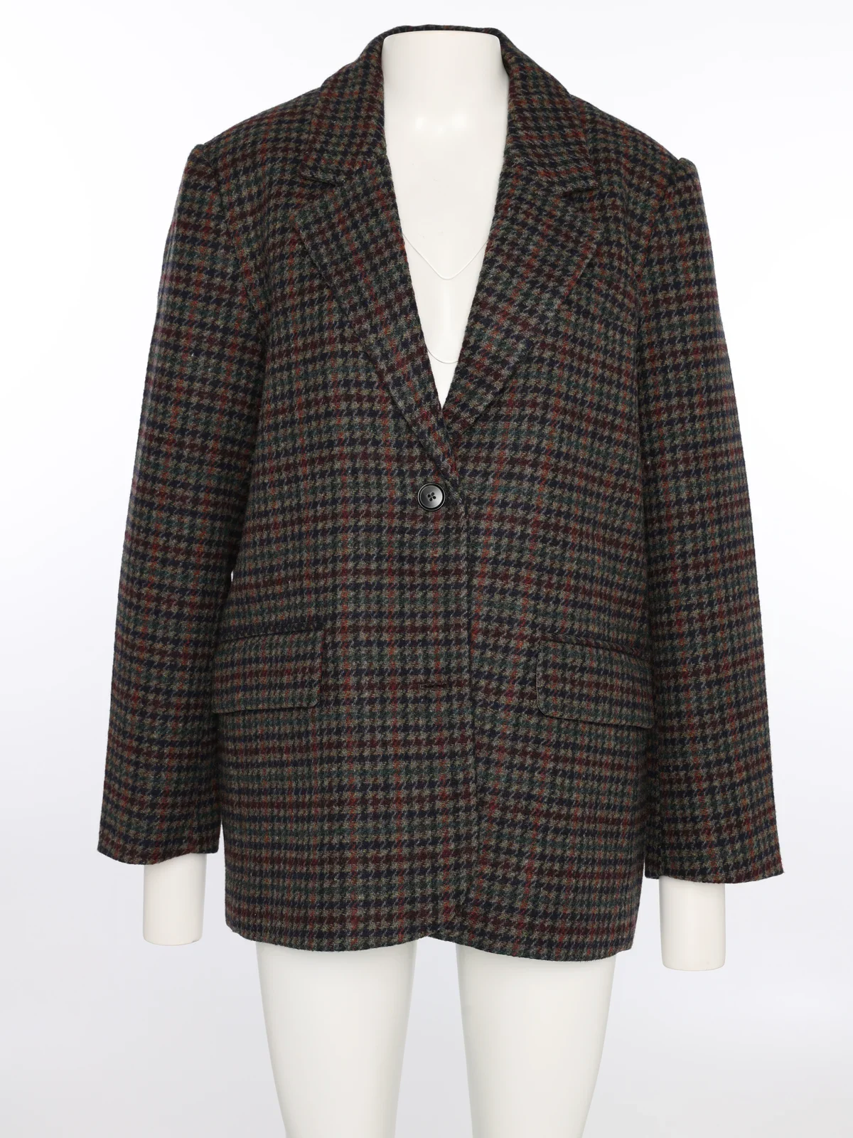 Dezelfde geruite blazer op een paspop