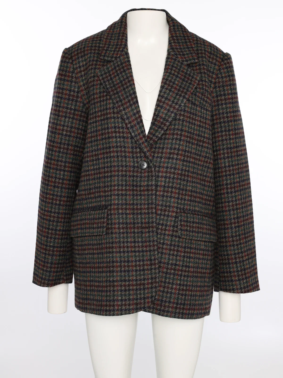Dezelfde geruite blazer op een paspop