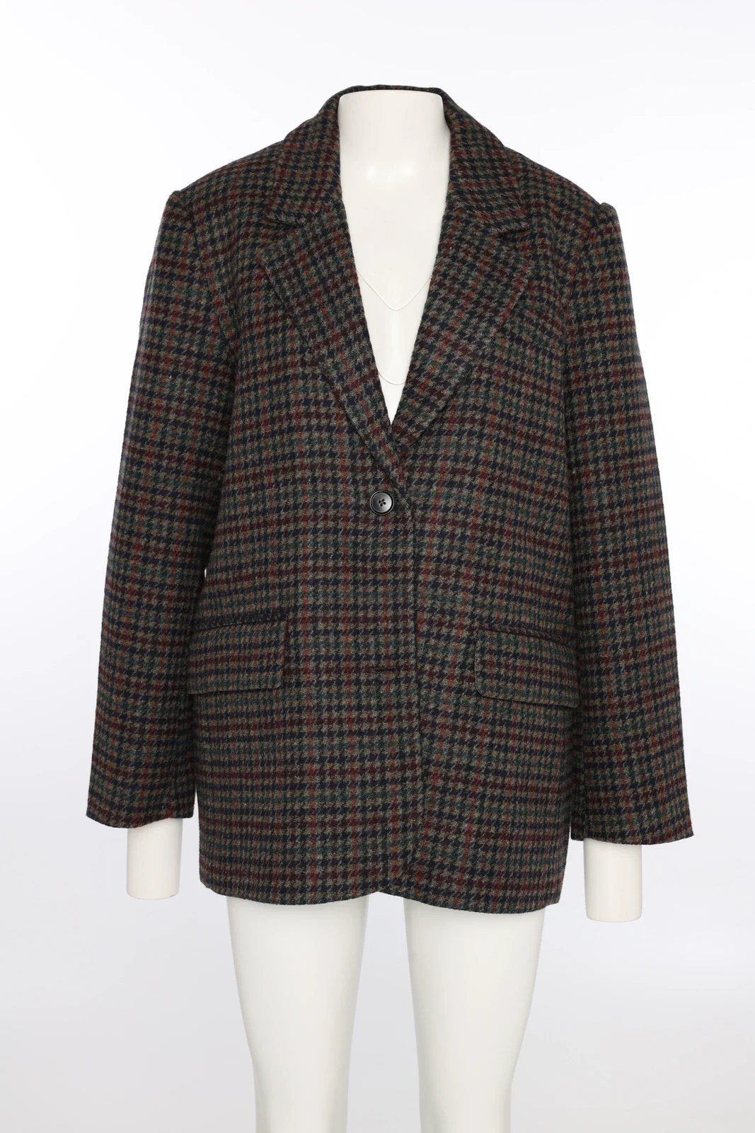 Geruite blazer op een paspop in de studio